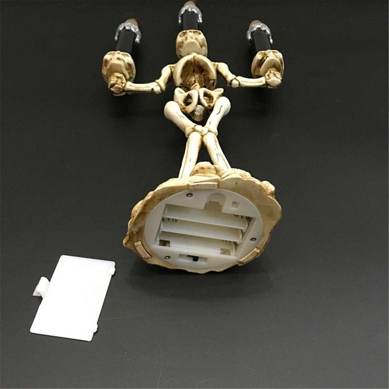 Candelabro led de calavera con tres cabezas